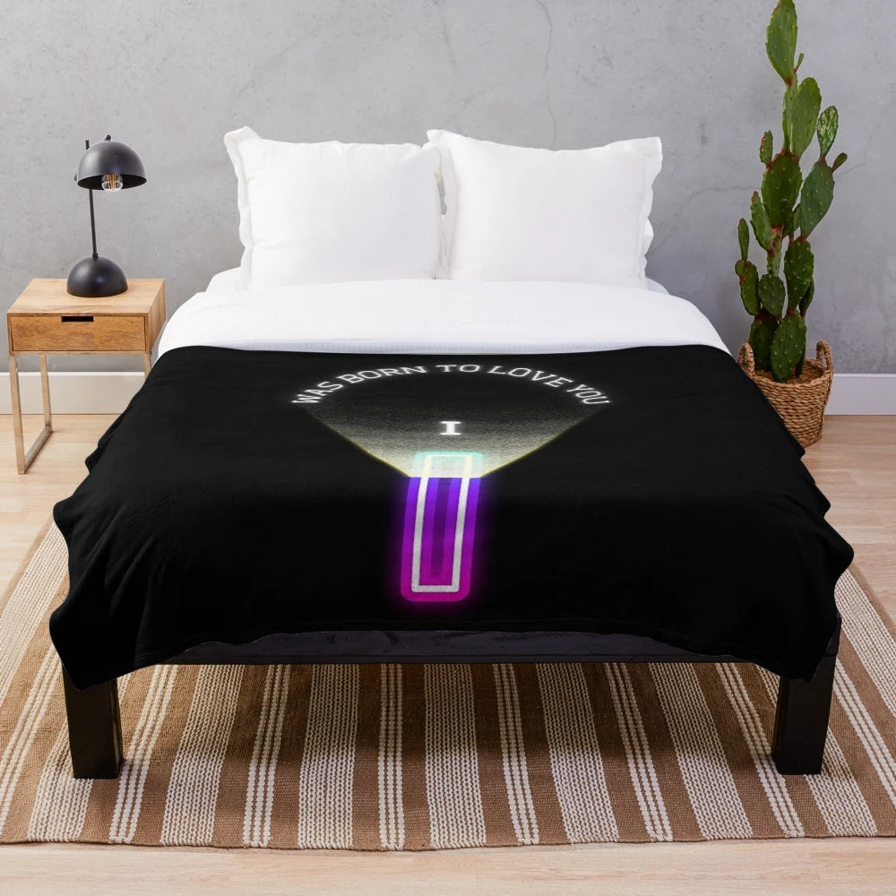 Soft and cozy plush blanket featuring the iconic phrase "I Was Born to Love You" from a classic rock band