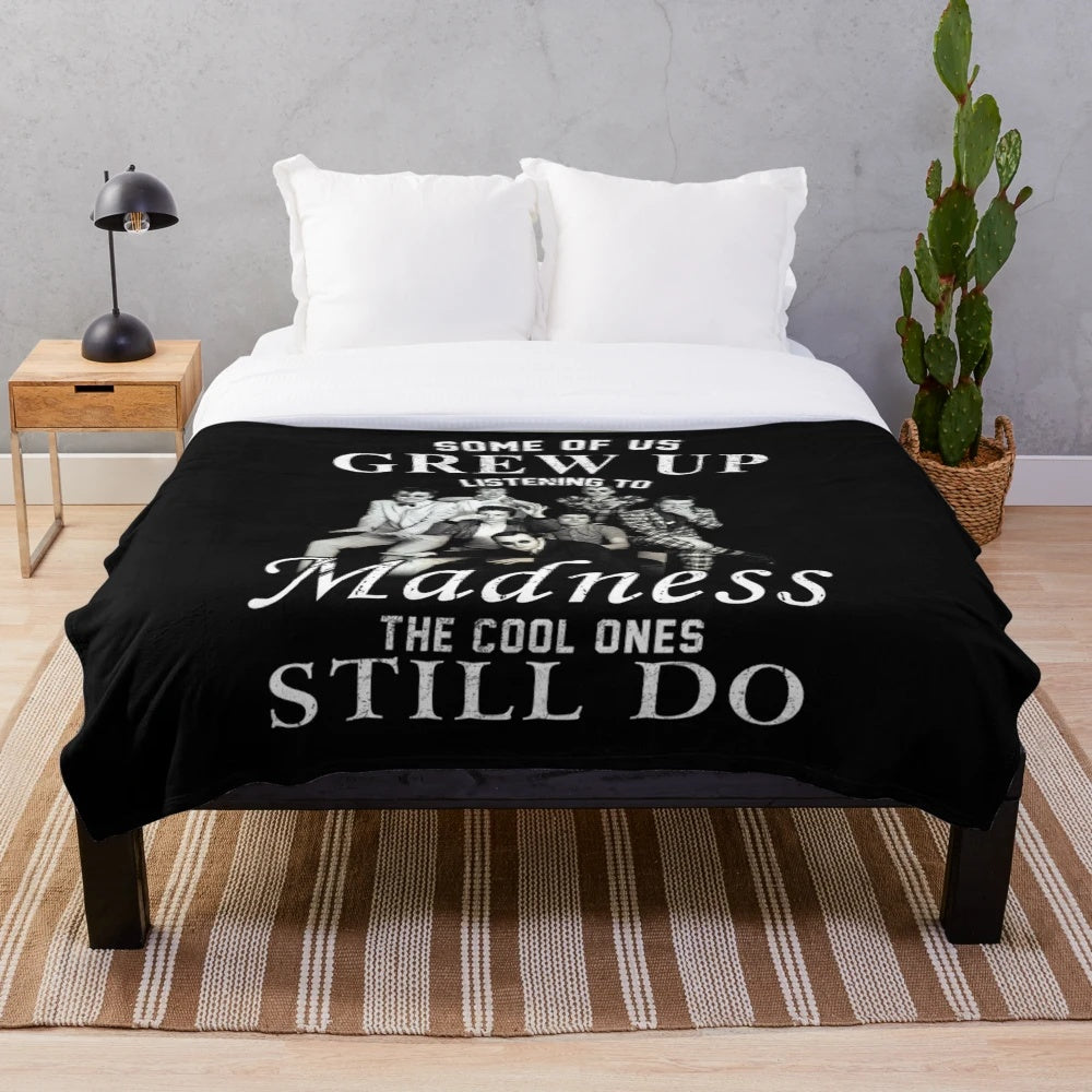 Plush blanket featuring retro music and band graphics