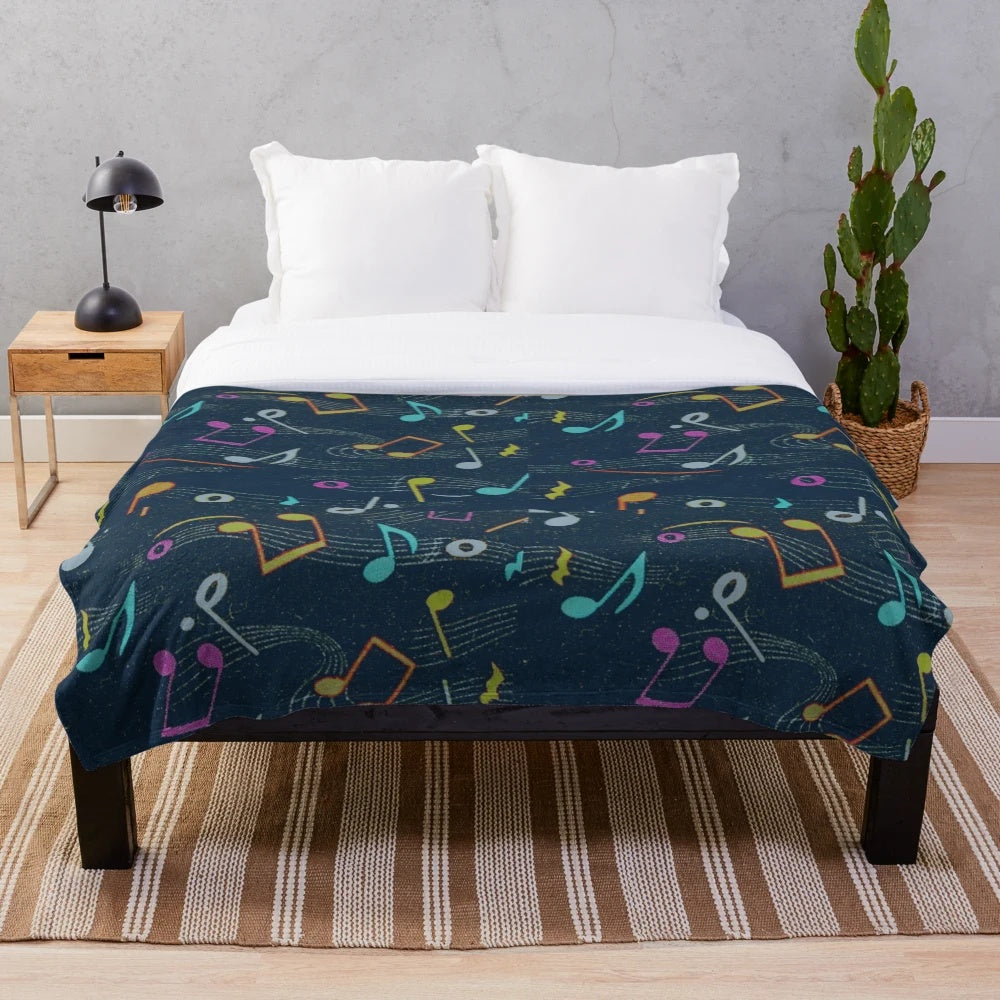 Colorful vintage-style plush blanket with retro musical notes pattern