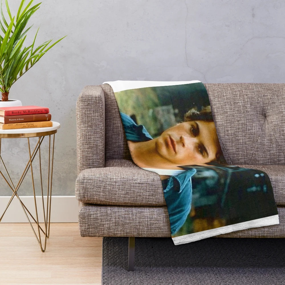 Retro Rob Lowe inspired plush blanket with 80s tv show and movie graphics