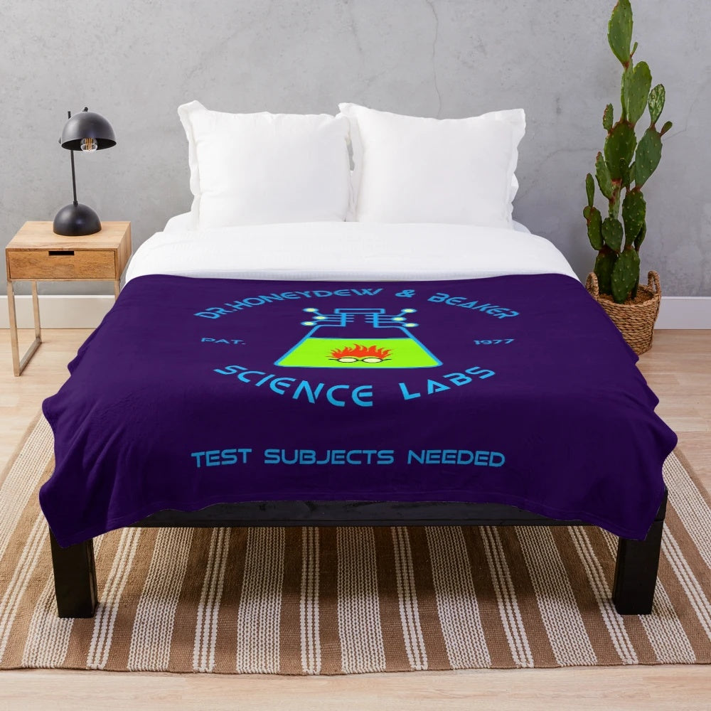 Retro science lab inspired plush blanket featuring Honeydew and Beaker characters