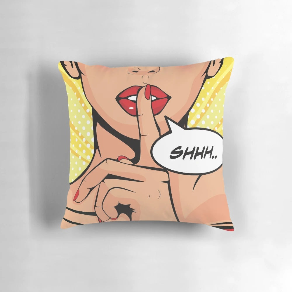 Vibrant pop art "Shhh" pillow in a retro comic strip style, featuring a woman with her finger to her lips against a colorful background.