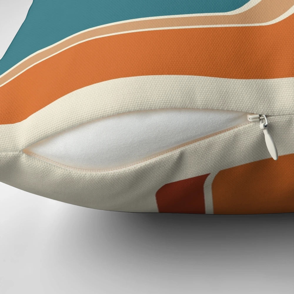 Retro striped pillow in vibrant orange, rust, and blue colors