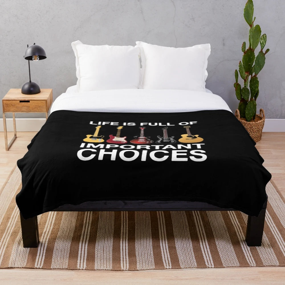 Guitar plush blanket with the text "Life Is Full of Important Choices