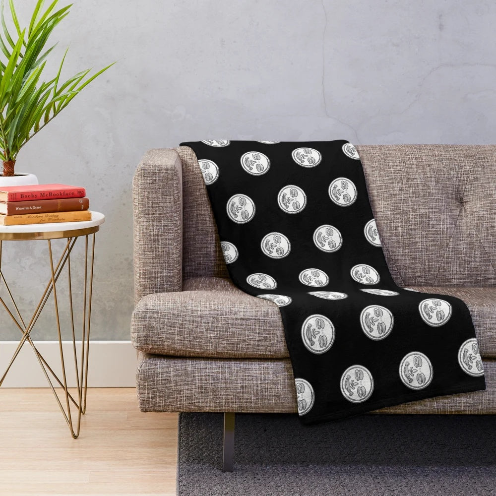 Rummikub-themed plush blanket with joker face design