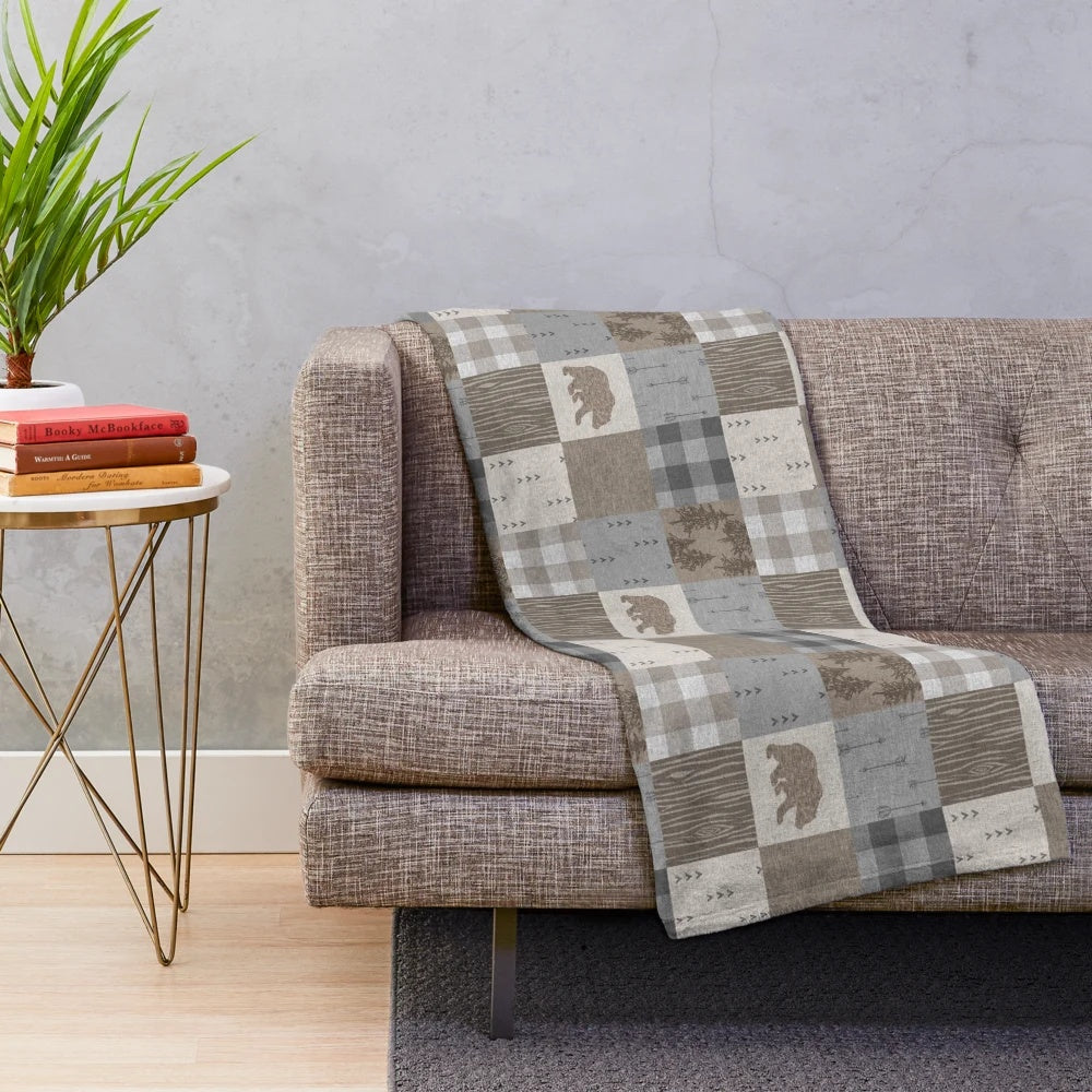 Rustic patchwork plush blanket with bear design for cozy woodland retreats