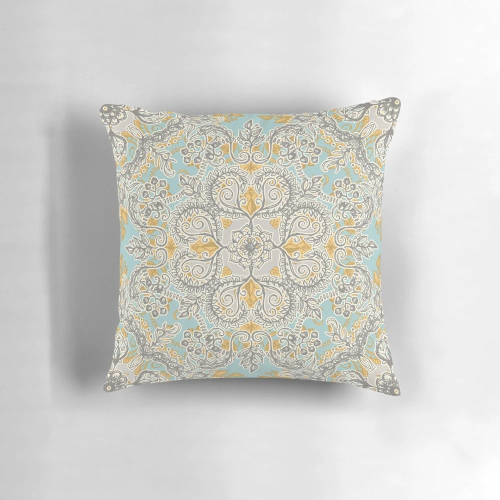 Gypsy floral pattern in soft neutral colors of grey, yellow, and sage on a decorative throw pillow.