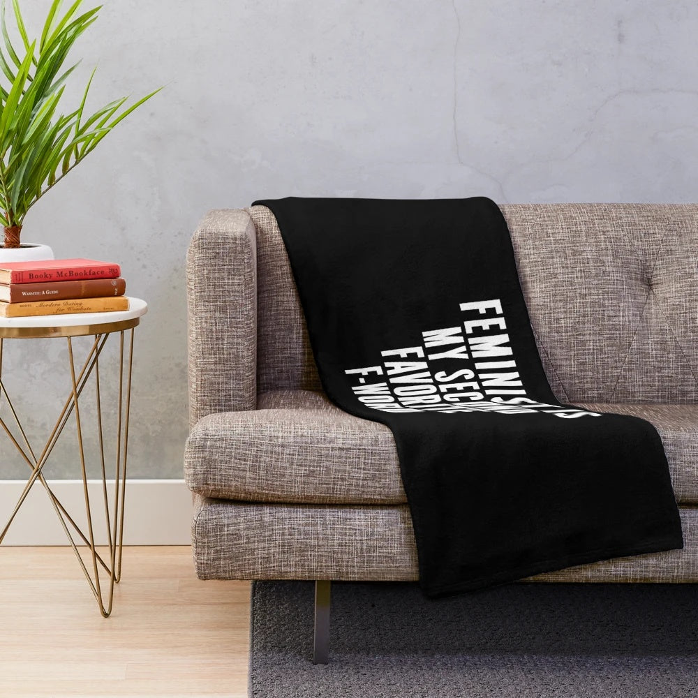 Plush blanket with the text "Feminist is My Second Favorite F Word