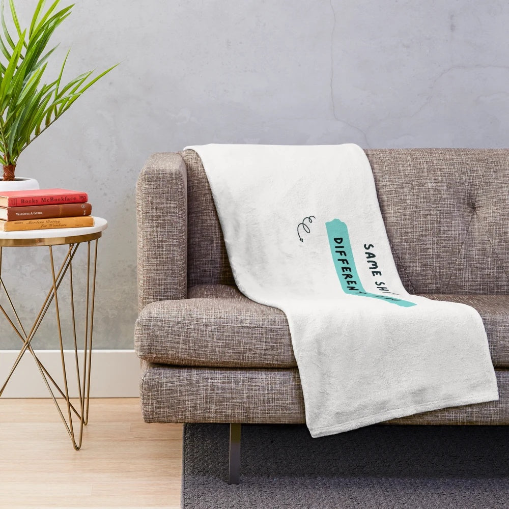 Plush blanket with a sarcastic "same shit, different day" attitude design