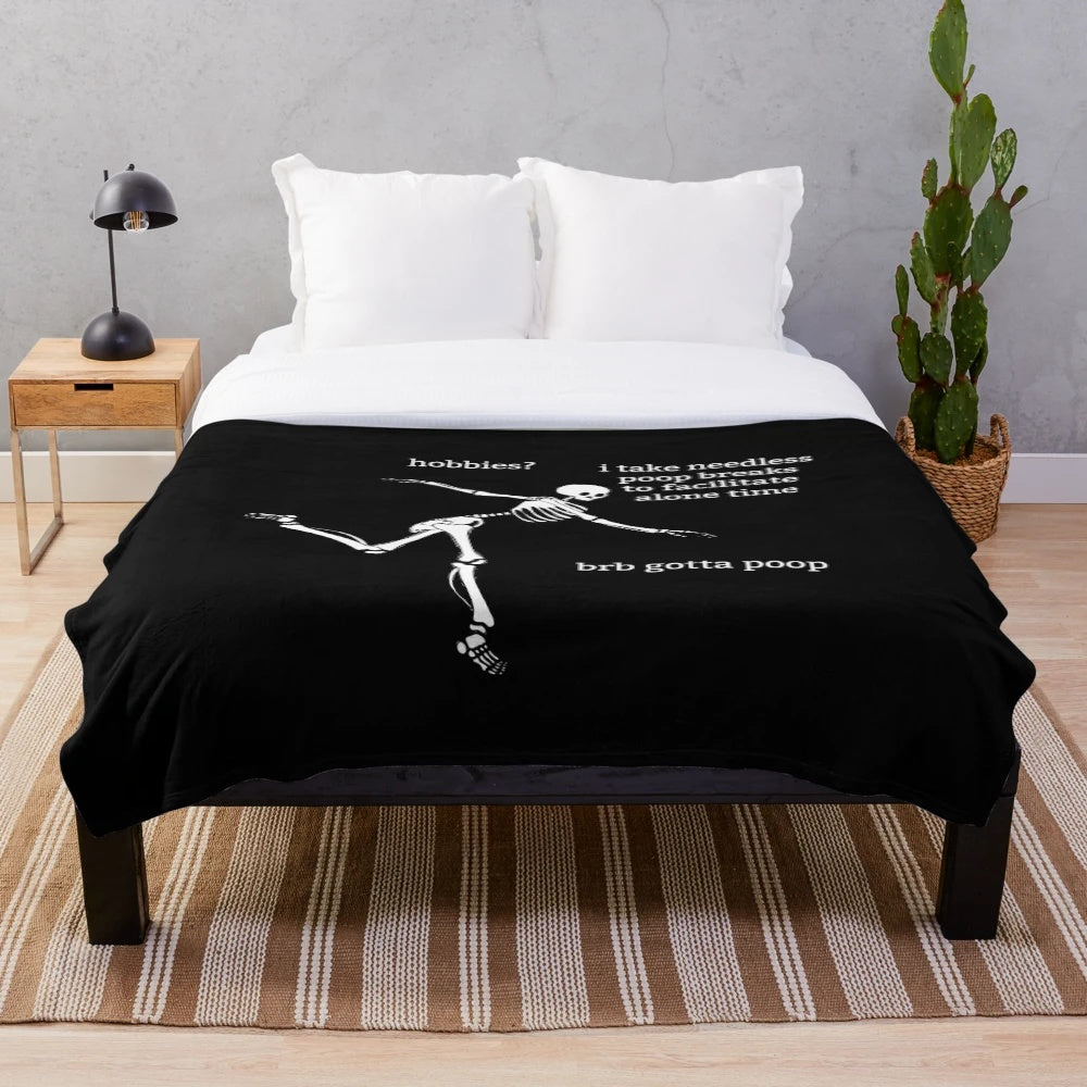 Sassy skeleton plush blanket with a humorous "Hobbies?" graphic
