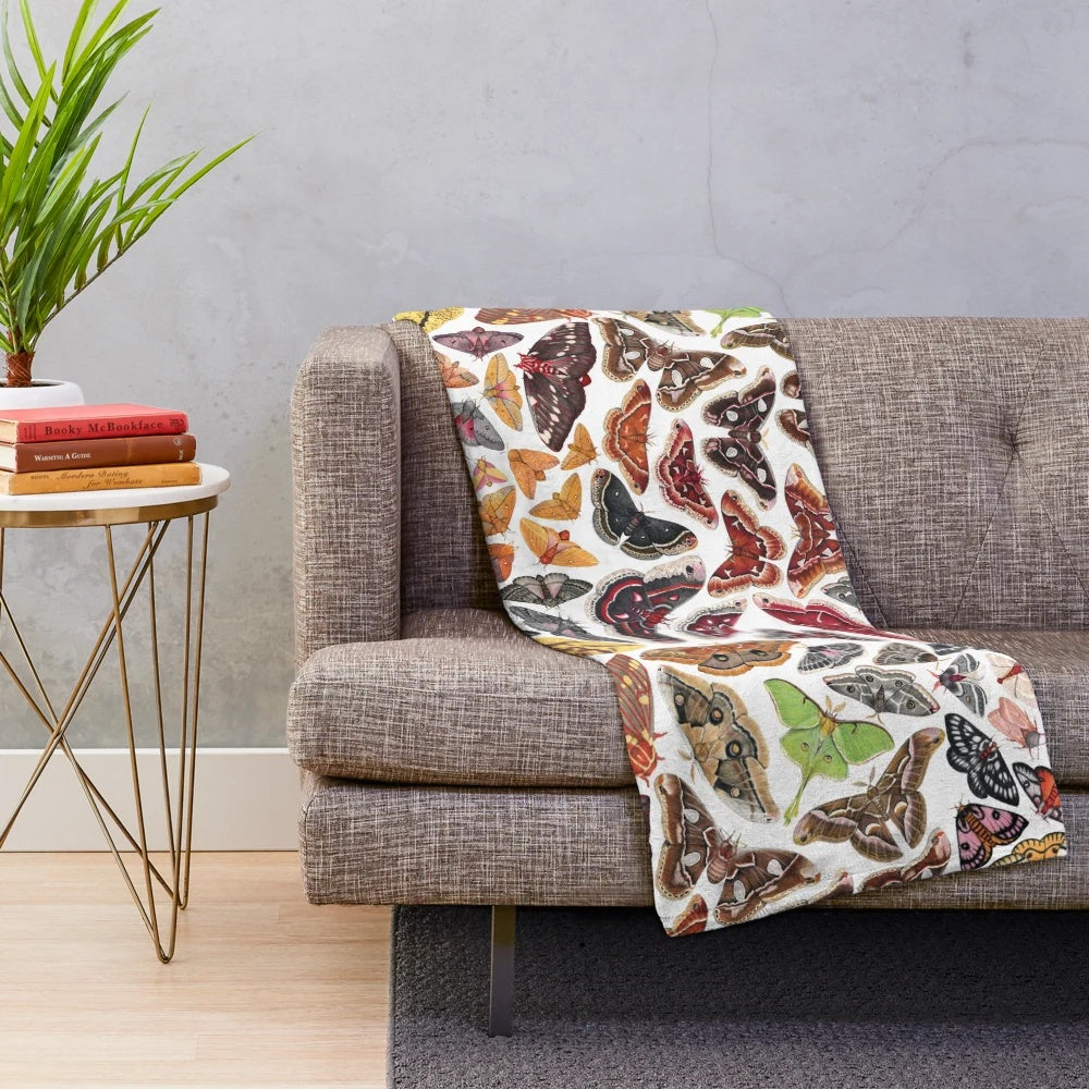 Soft plush blanket featuring a detailed illustration of saturniid moths from North America
