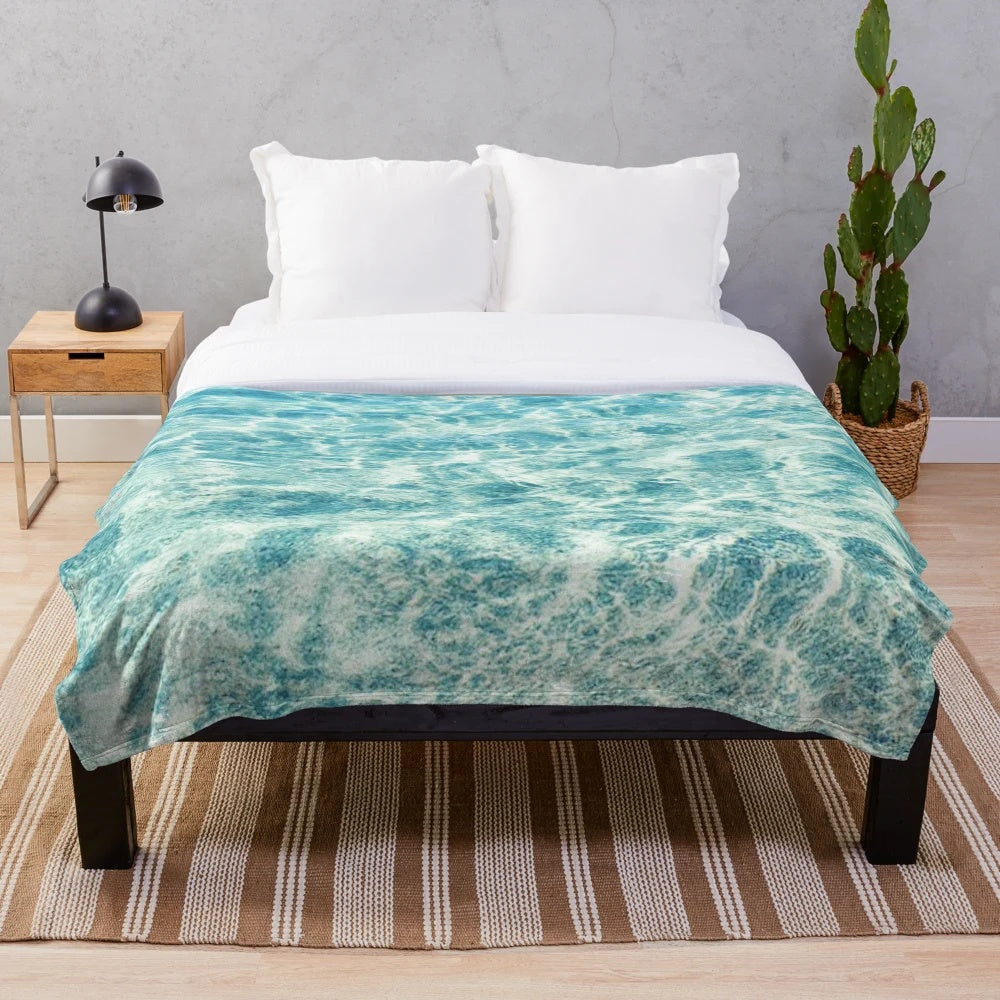 Soft and plush blue aqua blanket with ocean water design