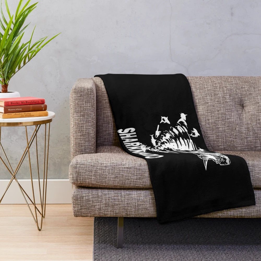 Sharknado-inspired plush blanket featuring iconic shark imagery