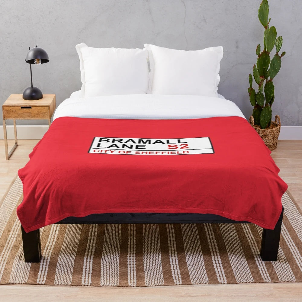 Soft and cozy plush blanket featuring the Sheffield football team and Bramall Lane street sign