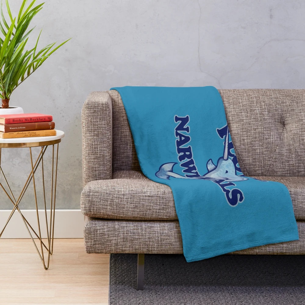 Narwhal plush blanket with a cute blue narwhal design