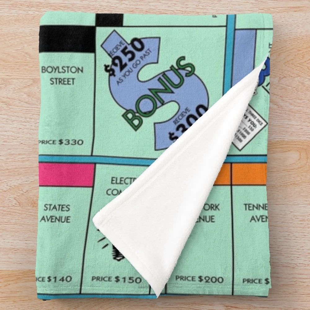 Soft and cozy Monopoly-themed plush blanket