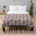 A plush blanket featuring a sleeping koala, supporting Australian wildlife conservation