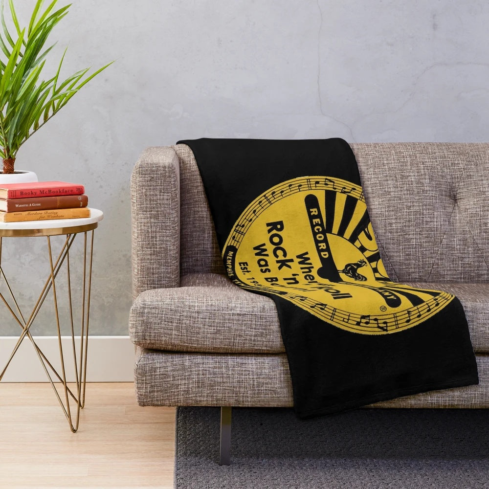 Soft and cozy plush blanket featuring the iconic Sun Records logo, perfect for music lovers.