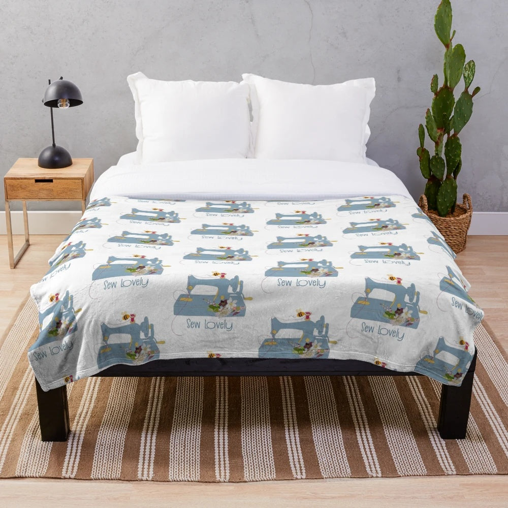 Cozy plush blanket featuring a sewing machine and floral embroidery pattern