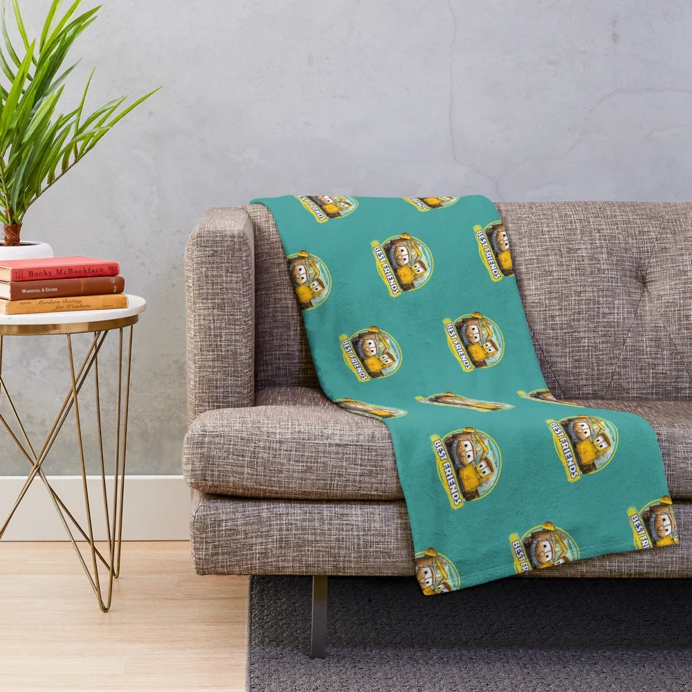 Cozy kids plush blanket featuring excavator and bulldozer designs from The Stinky and Dirty Show