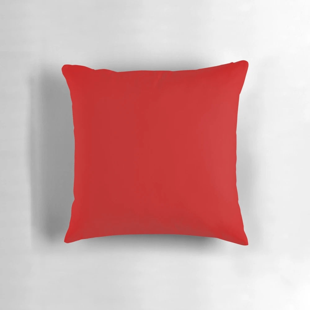 Cherry red solid color decorative pillow with a simple, minimalist design.