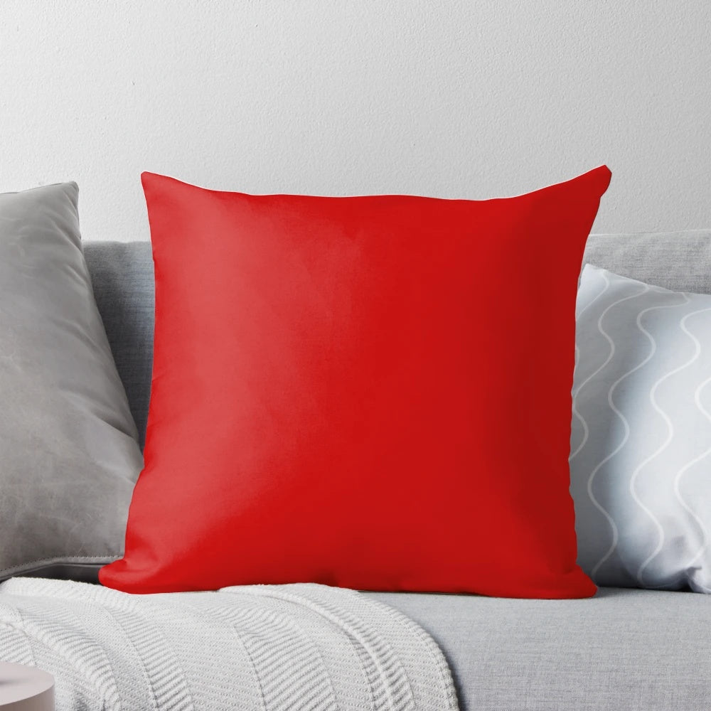 Cherry red solid color decorative pillow with a simple, minimalist design.