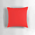 Solid red throw pillow with a variety of rich, vibrant red tones