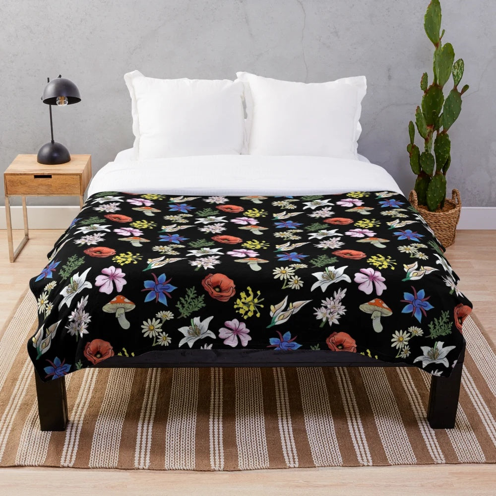 Soft and cozy plush blanket featuring a watercolor-style floral design inspired by the indie game SpiritFarer
