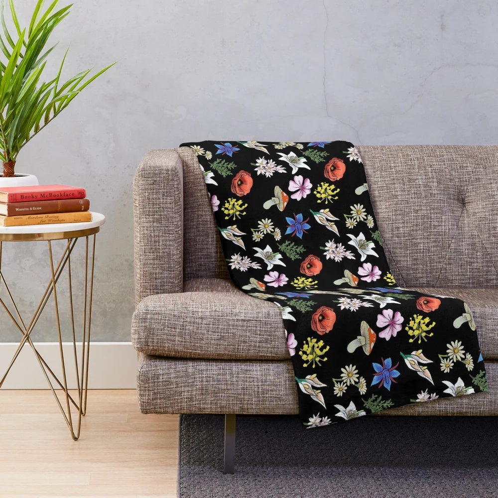 Soft and cozy plush blanket featuring a watercolor-style floral design inspired by the indie game SpiritFarer