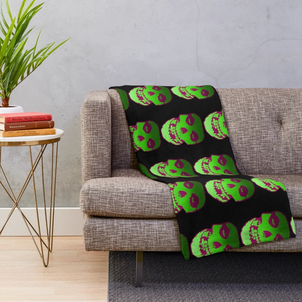 Misfit-inspired plush blanket featuring a skull design