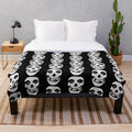 Misfits-inspired plush blanket with skull and logo design