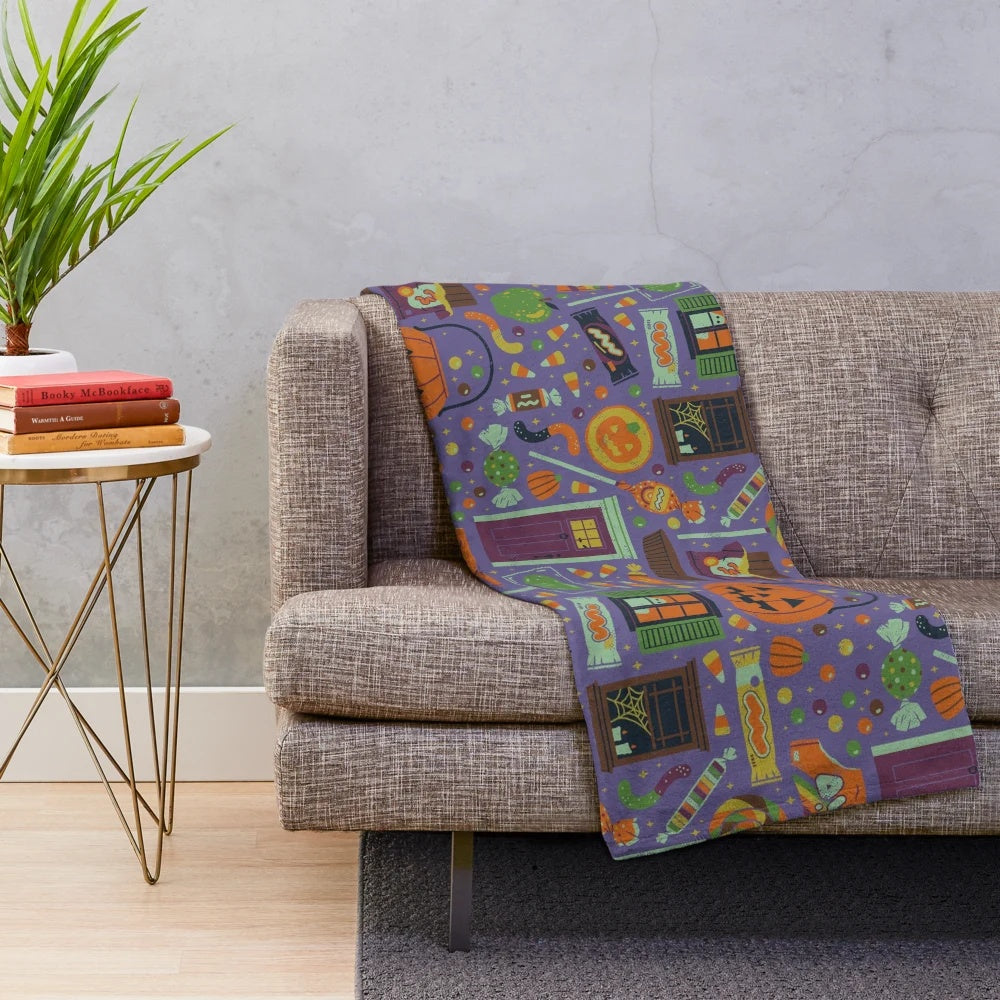 Spooky plush blanket featuring whimsical Halloween designs