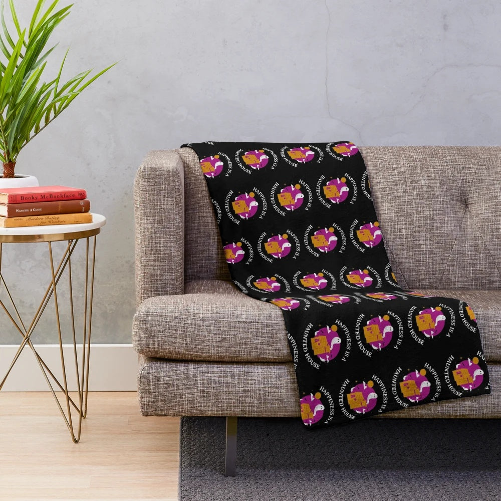 Plush purple Halloween blanket with haunted house design