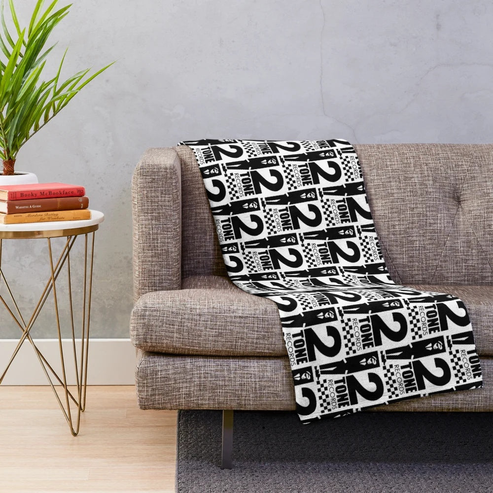 Black and white plush blanket with 2 tone records design