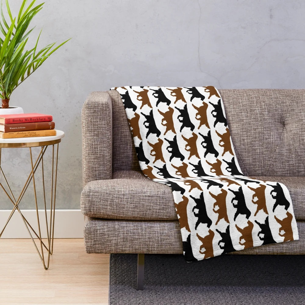 Black and liver flat coated retriever dog silhouette pattern on plush blanket