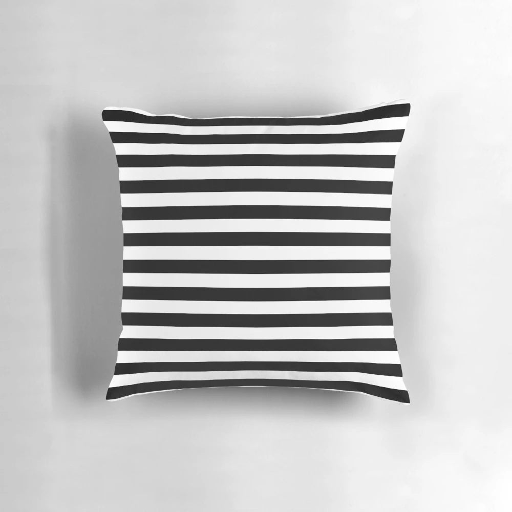 Black and white striped duvet cover and pillows on a bed