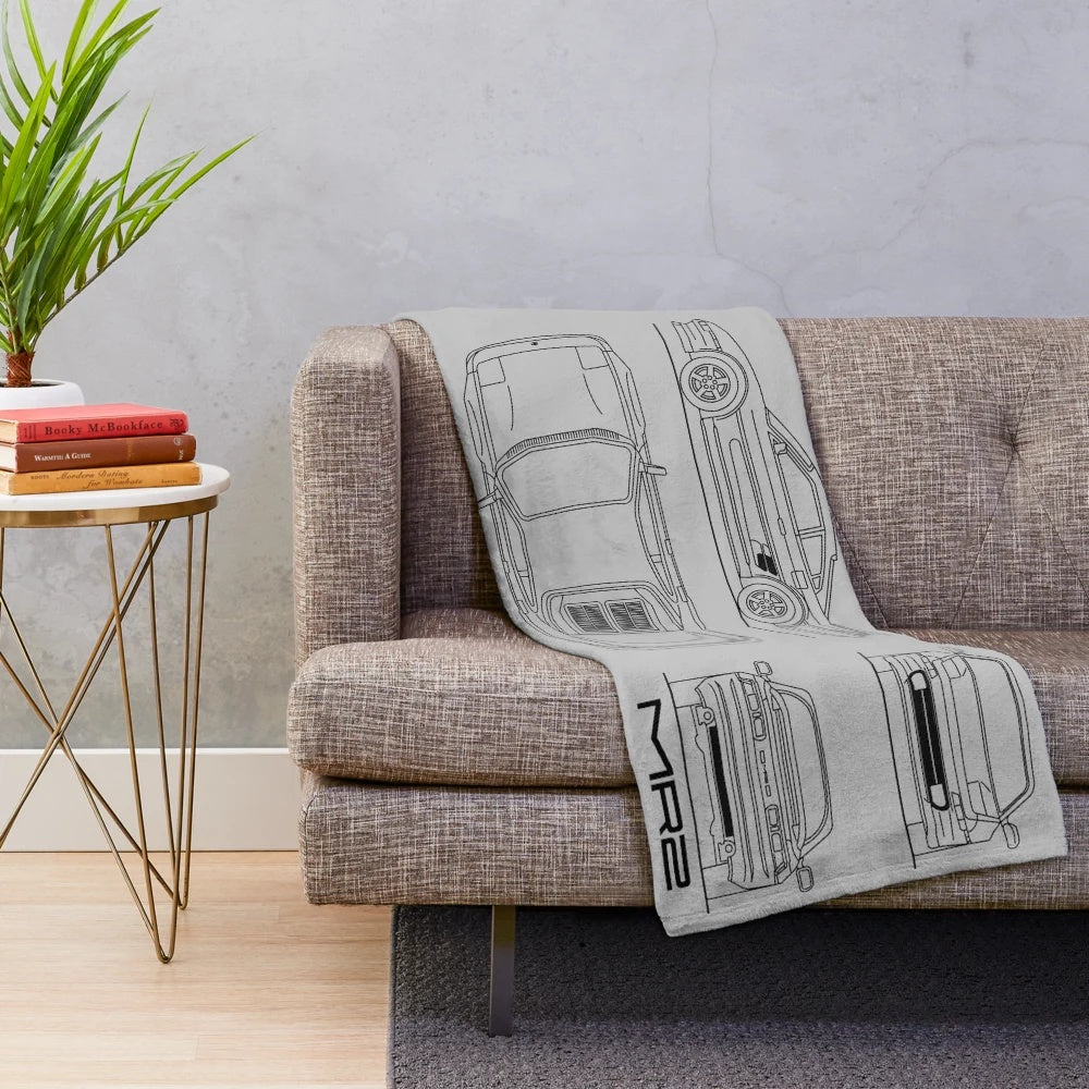 Black plush blanket featuring the iconic Toyota MR2 sports car design