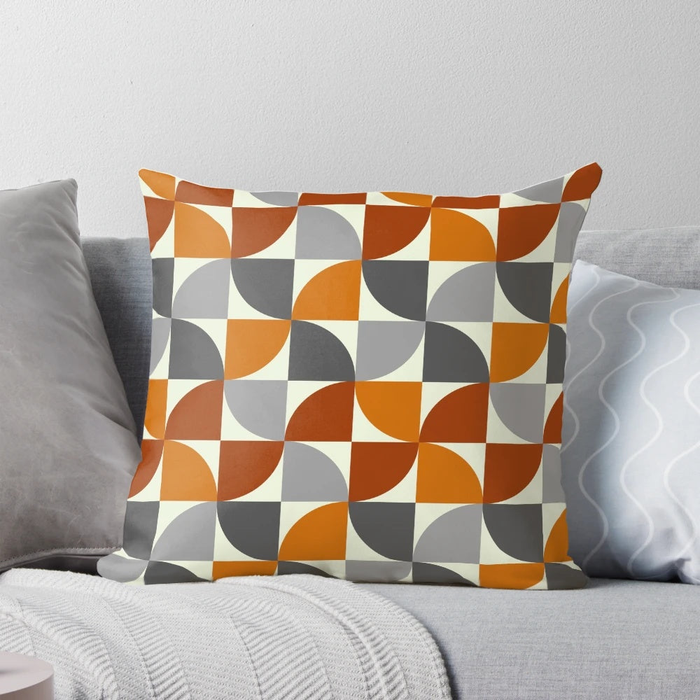 Mid century modern style throw pillow with a geometric pattern in grey and orange colors