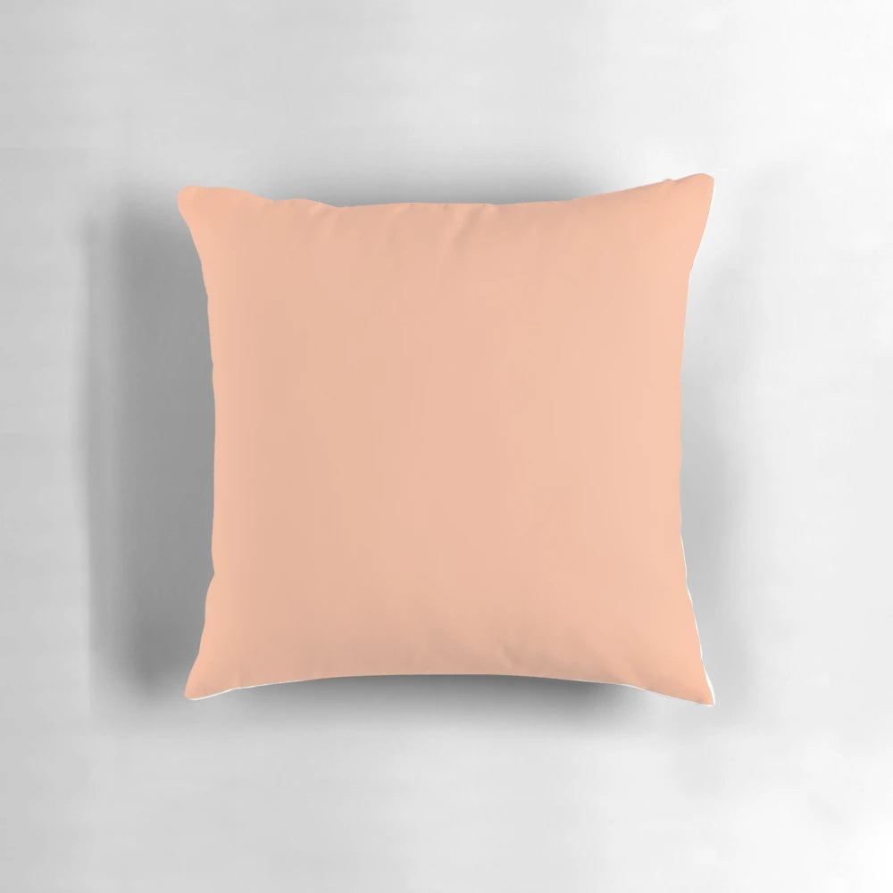 Peach-orange solid color pillow with a simple, minimalist design for bedroom decor.