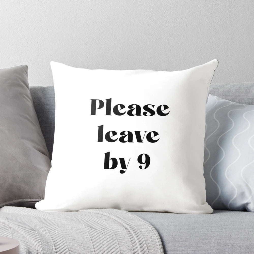 A black and white minimalist pillow with the text "Please Leave by 9" printed on it, perfect for home decor, office, or gallery wall.