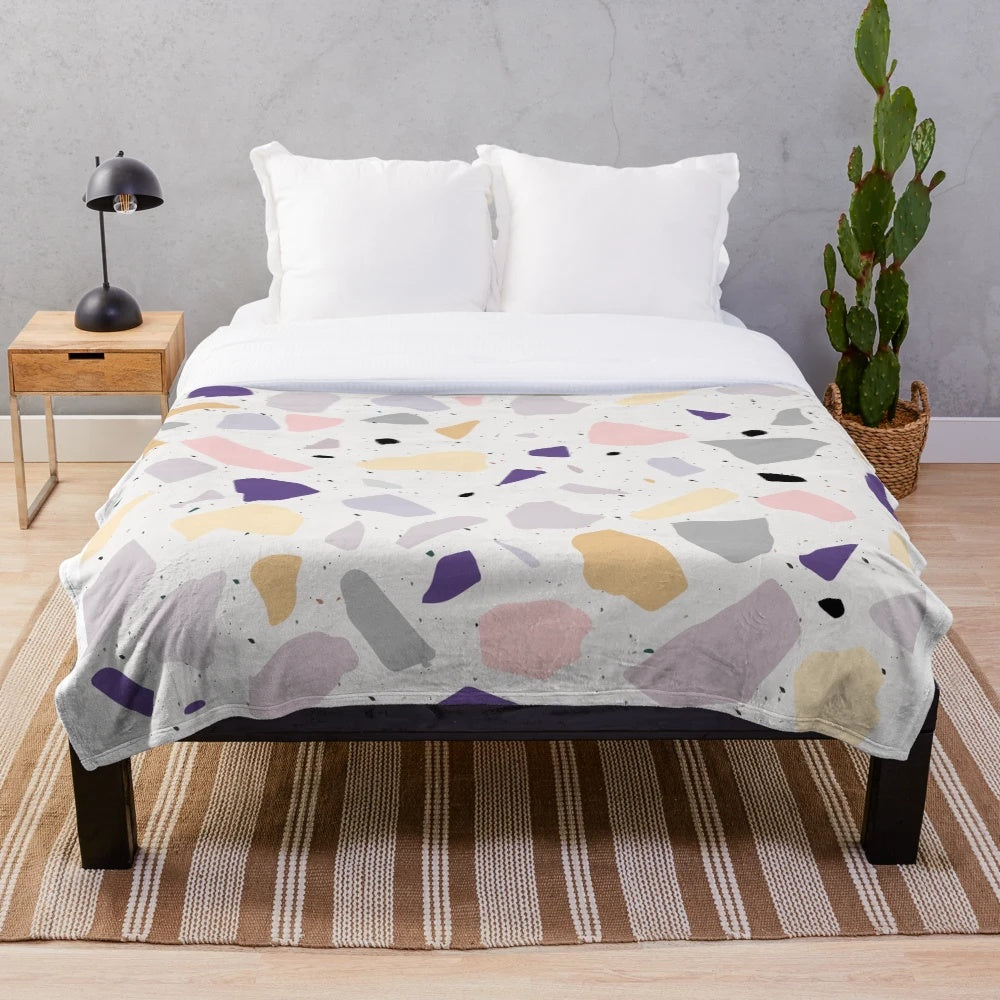 Plush blanket with colorful terrazzo design