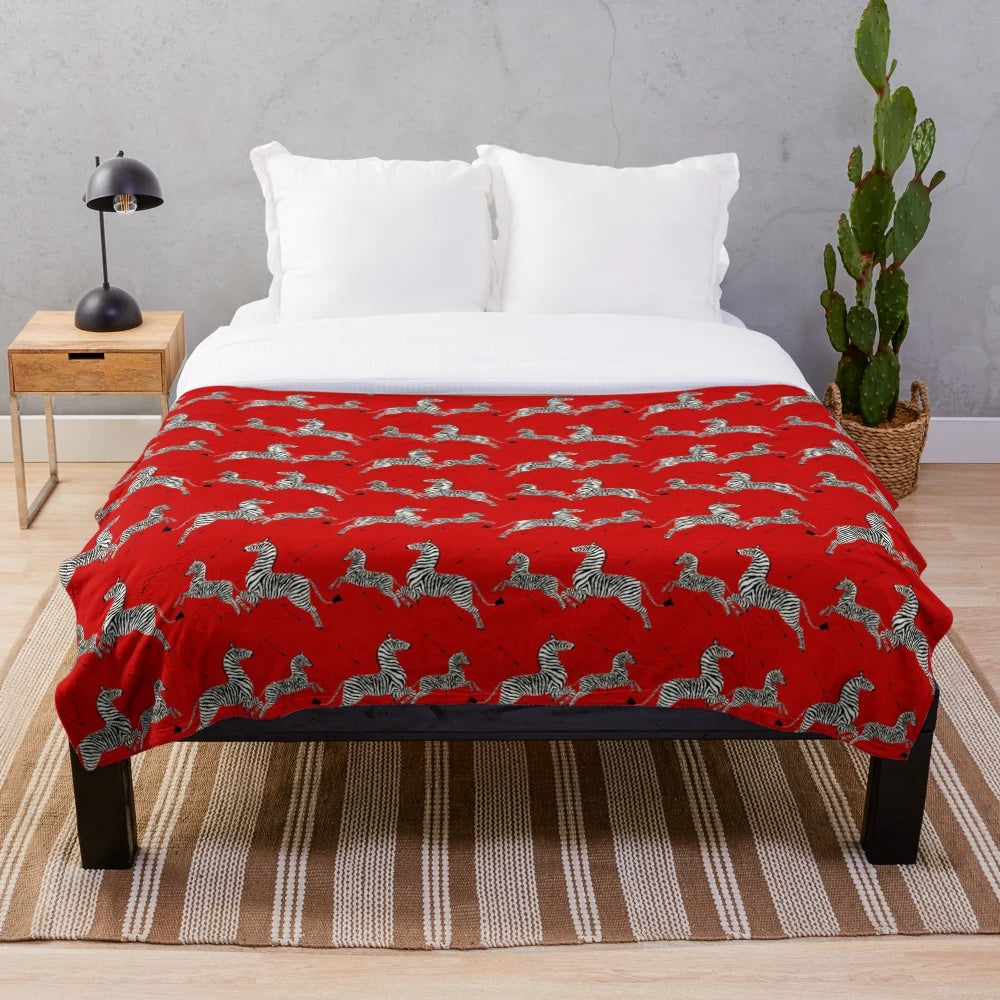 Red zebra print plush blanket inspired by Wes Anderson's The Royal Tenenbaums