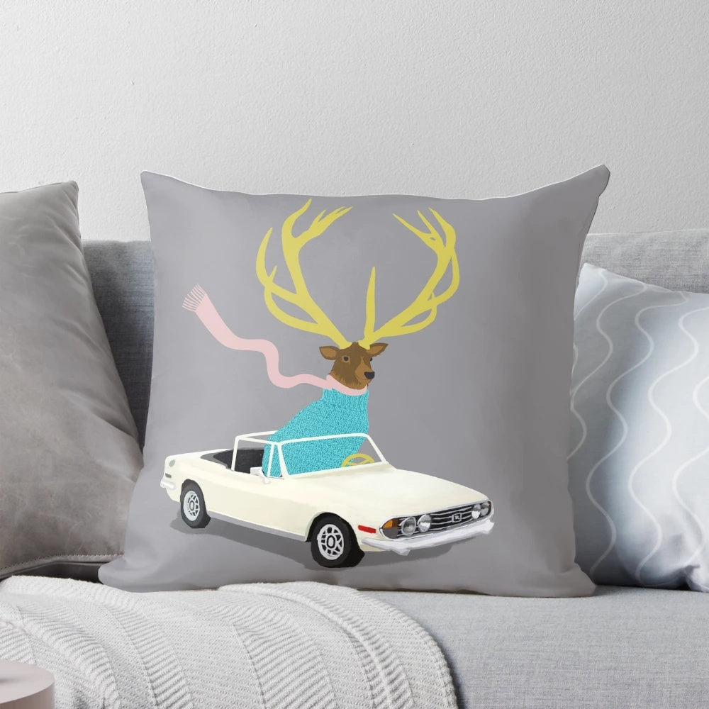 A white and grey stag-themed decorative pillow with horns