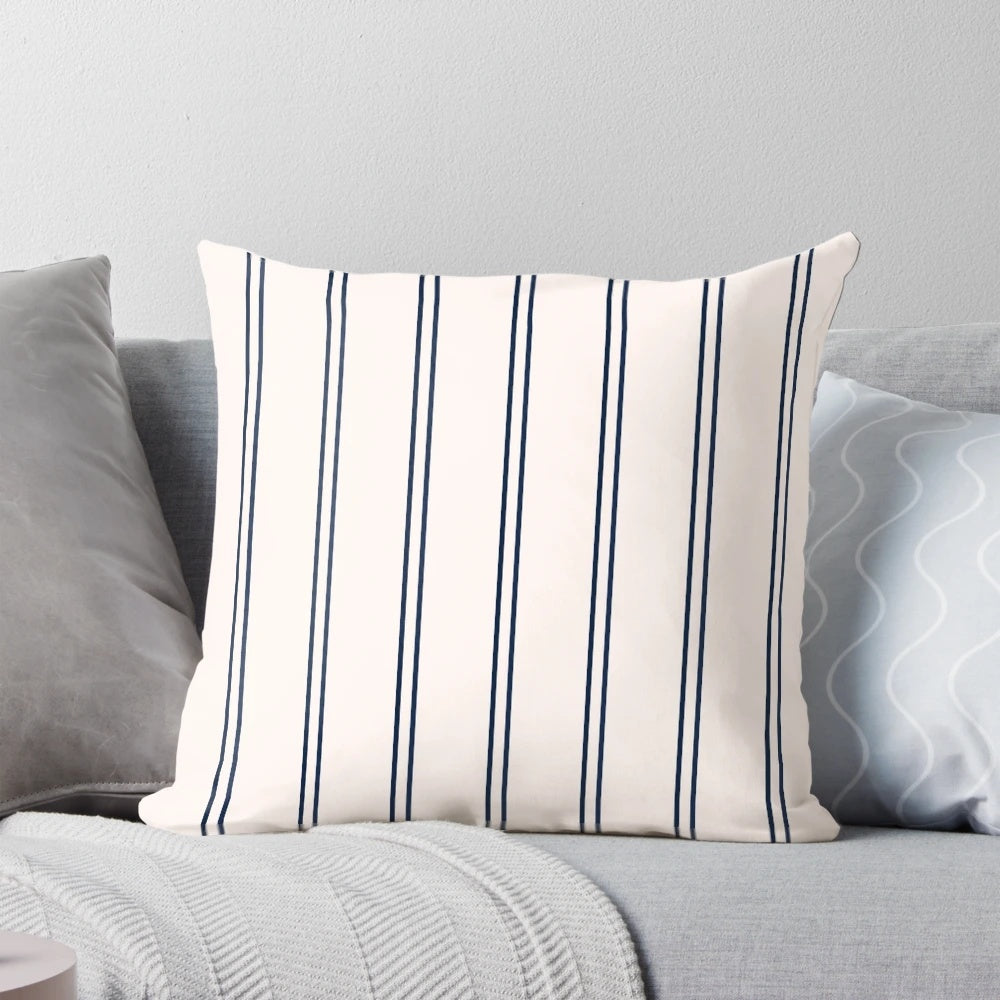 Striped navy blue and white pillow with a minimalist design
