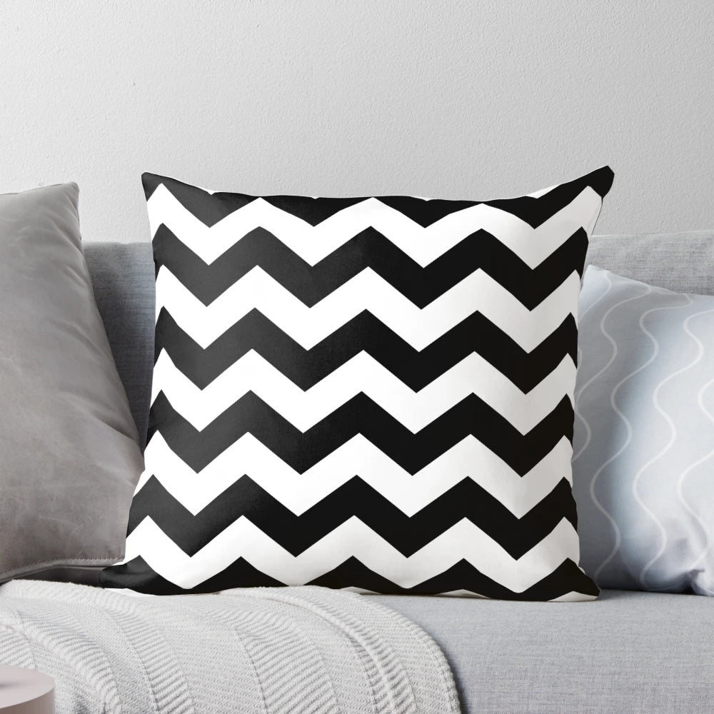 Black and white zig zag pattern throw pillow with a contemporary, minimalist design.