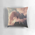 Surreal vintage-style pillow with a collage design of a woman in a landscape with mountains and clouds.