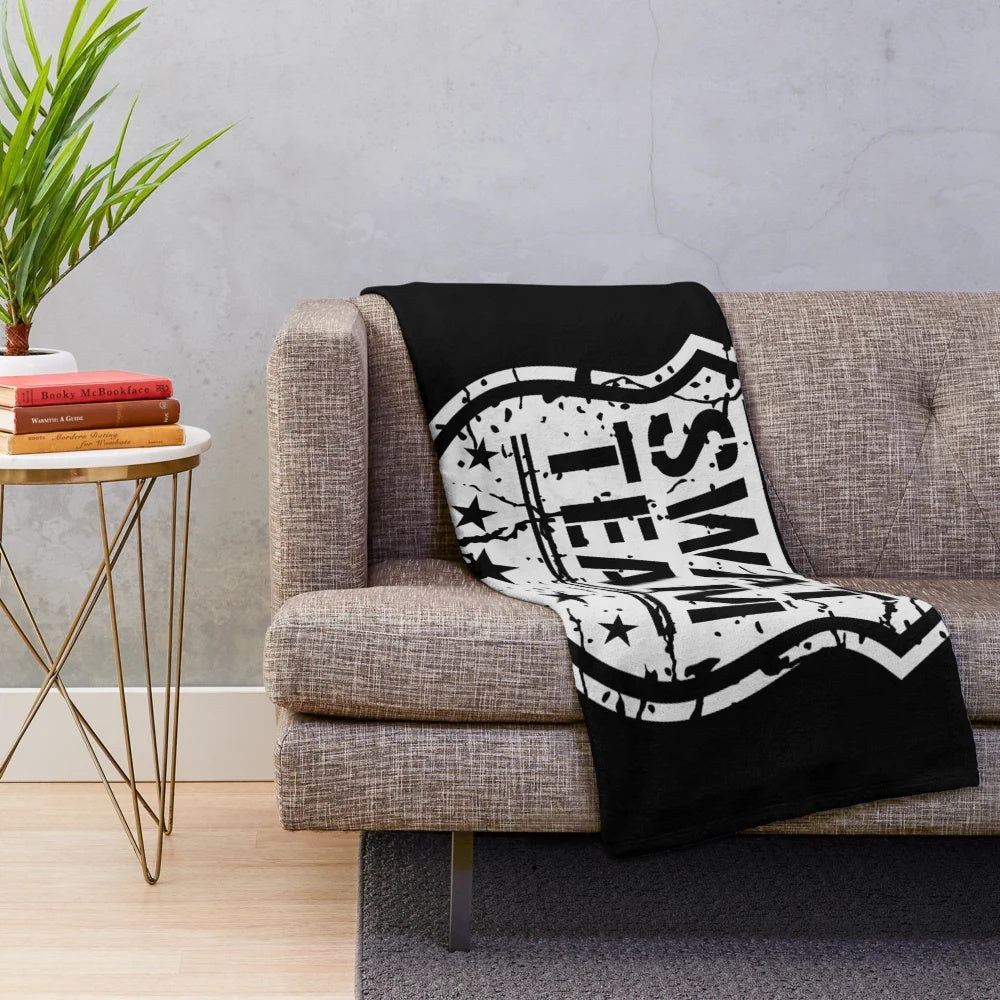 Tactical shield-inspired plush blanket with a distressed, grunge design