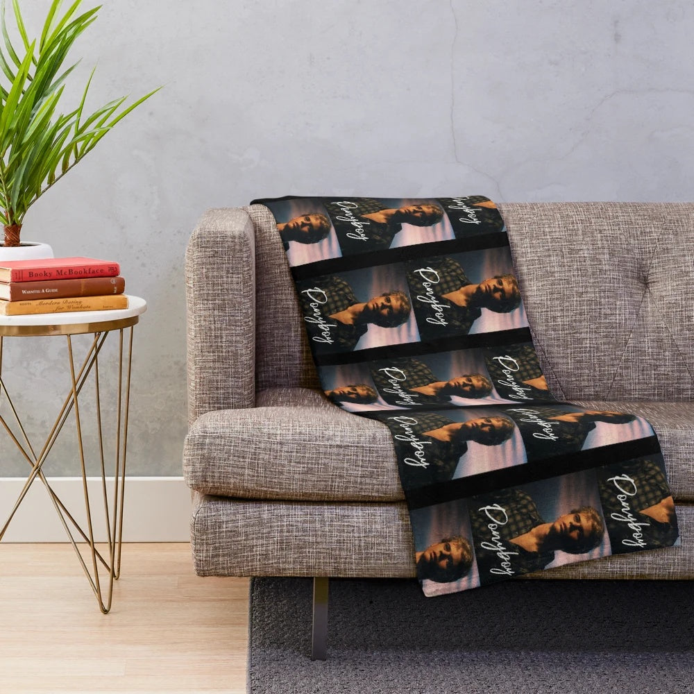 Ponyboy Curtis from the 80s movie "The Outsiders" printed on a plush blanket