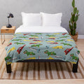 Thunderbirds-inspired plush blanket with a retro sci-fi spaceship pattern