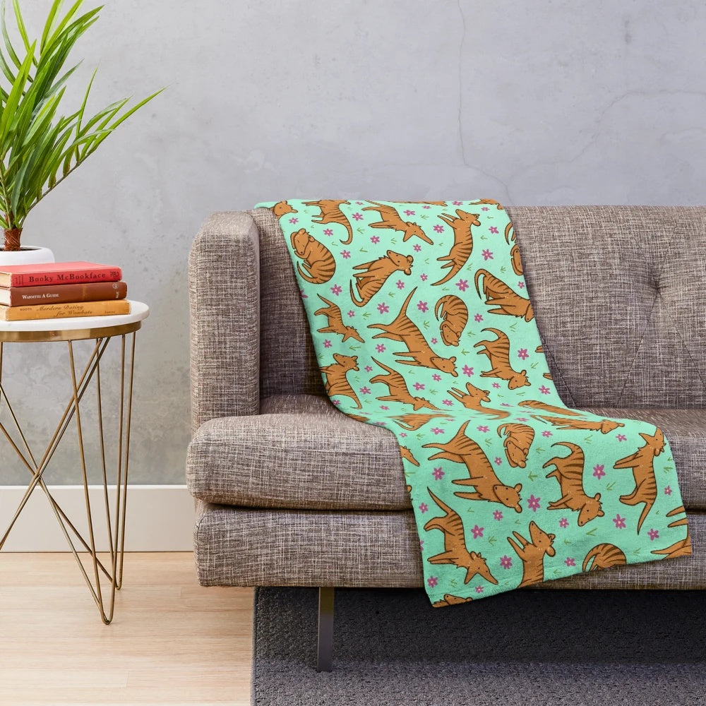 Thylacine pattern plush blanket with floral and nature inspired design